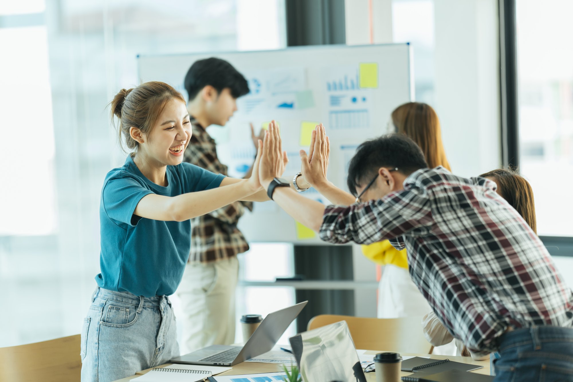 vecteezy_happy-employees-giving-each-other-a-high-five_7389455_284